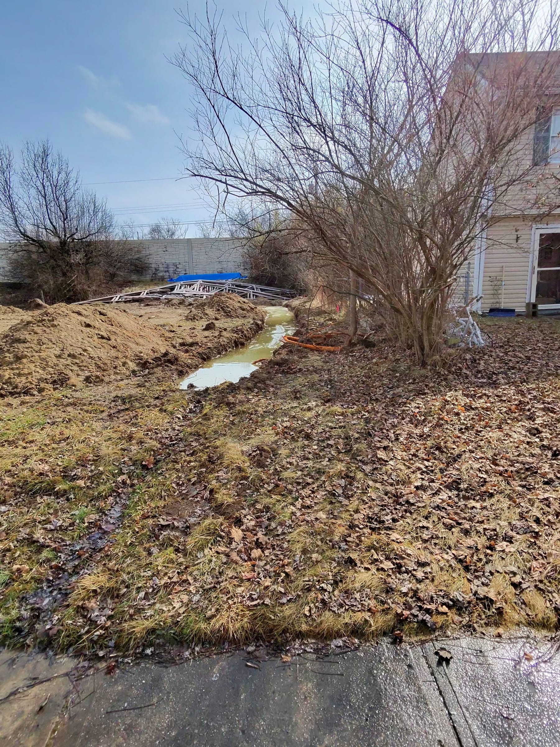 Standing water in the unfinished footer area before the renewed excavation