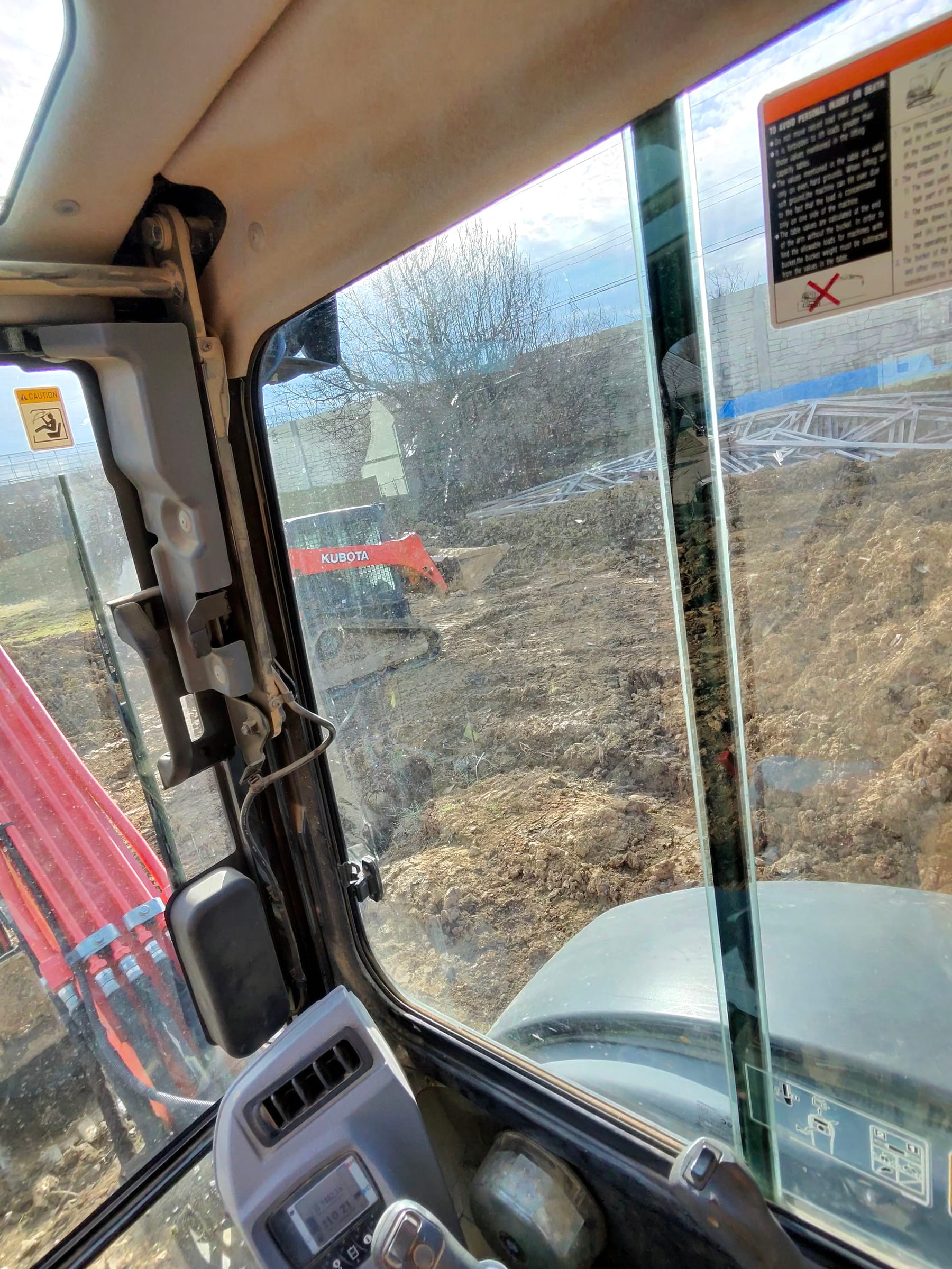 Footer excavation progressing with compact equipment on site