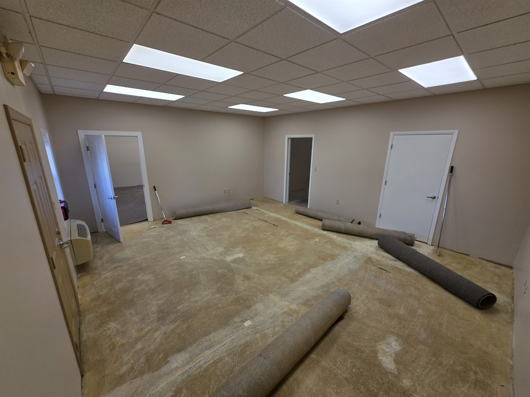 Existing carpet rolled back during removal