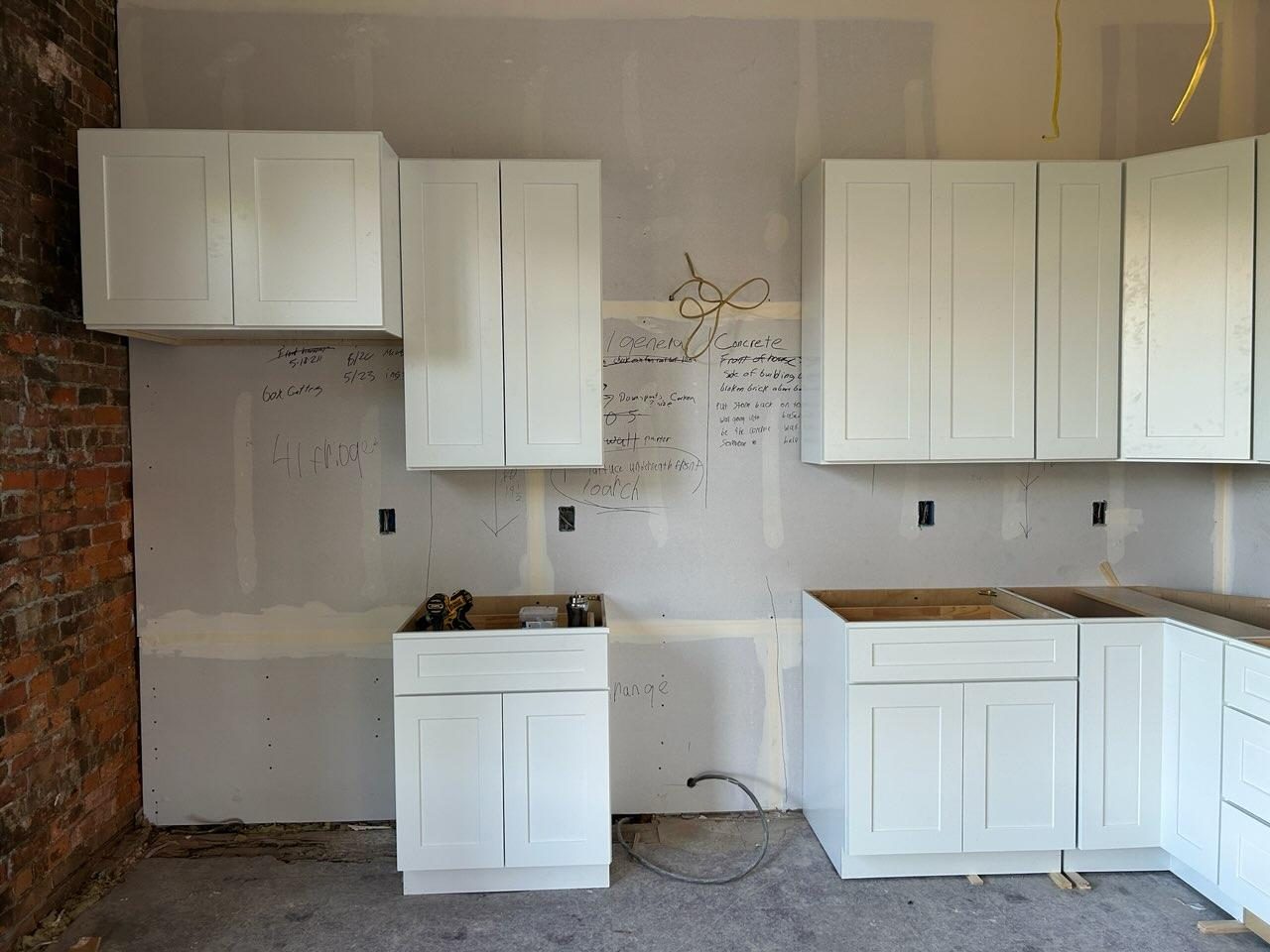 White shaker cabinets installed in the property-flip kitchen