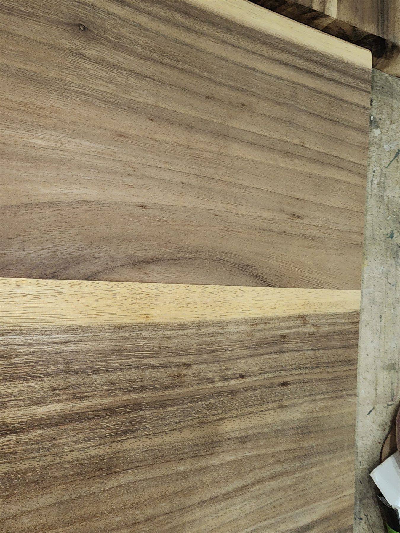 Repaired wood countertop surface being flattened and prepared