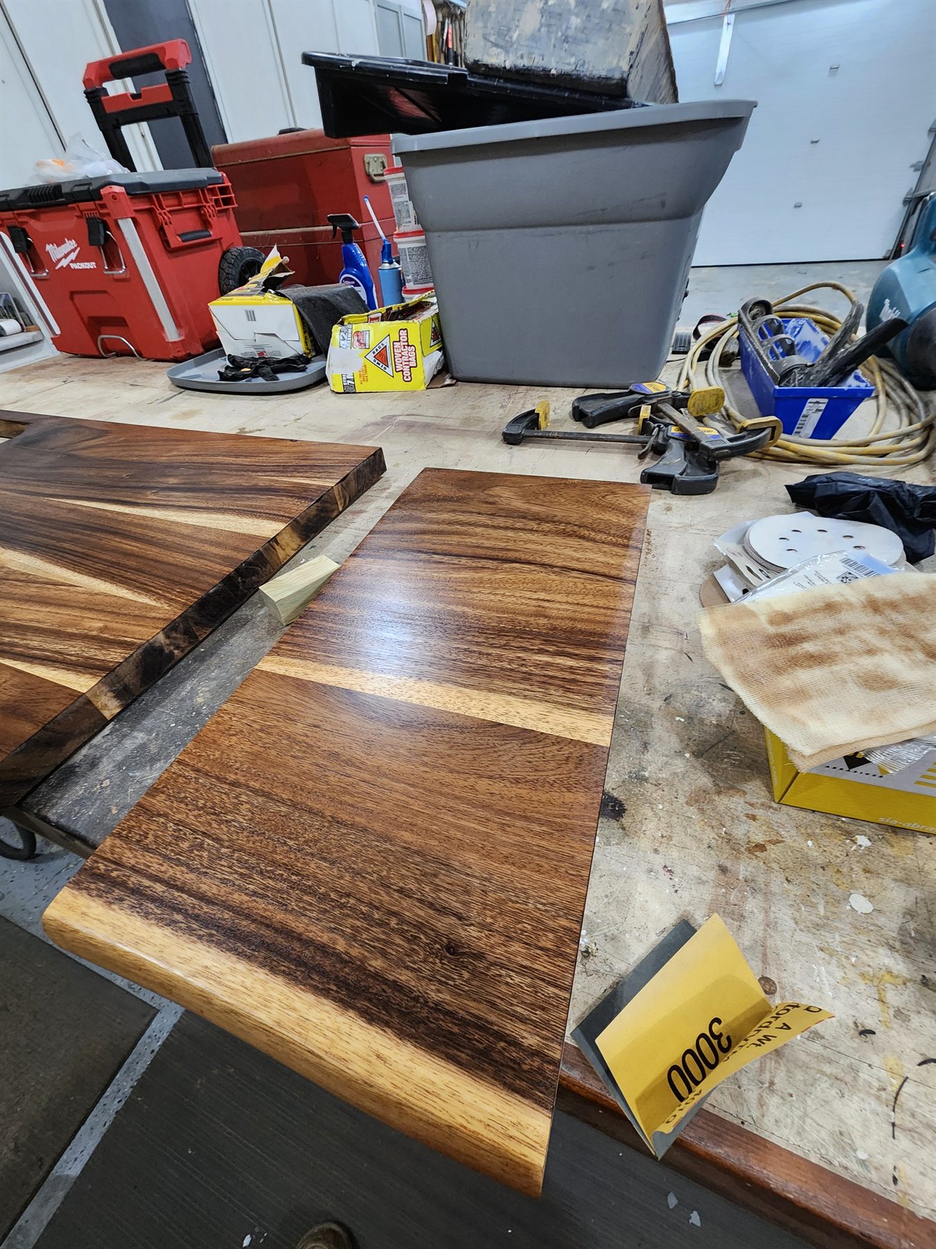 Repaired countertop sections receiving final sanding and finish work