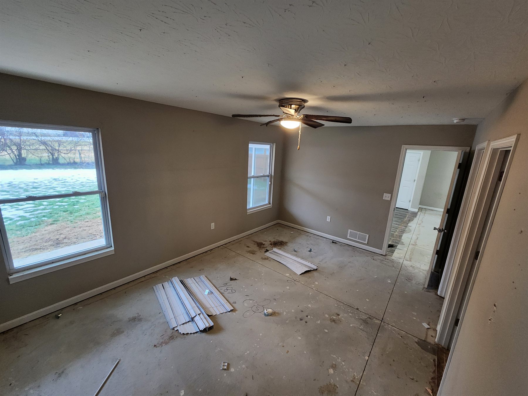 Living room stripped to the subfloor