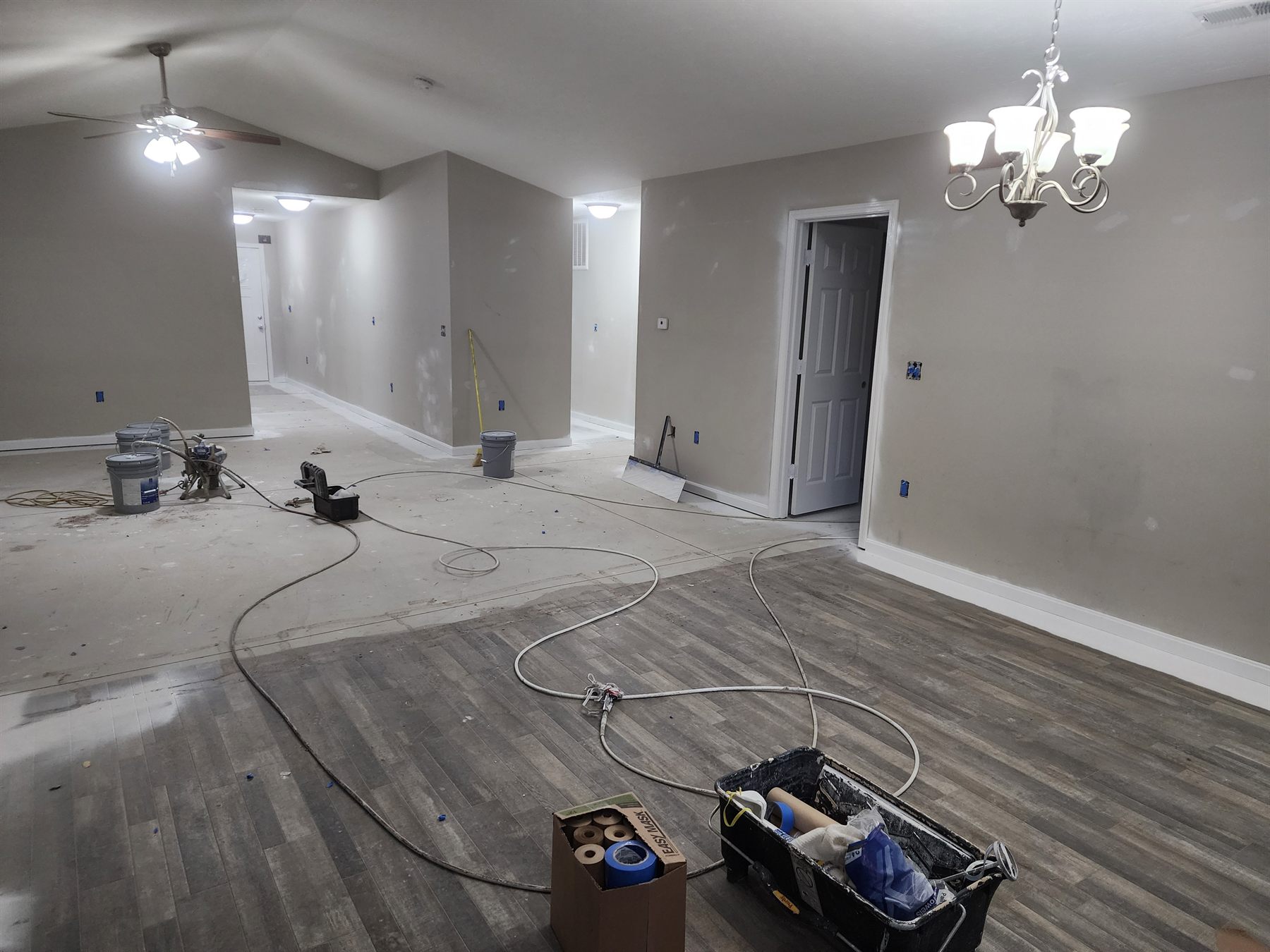 Main living area during wall preparation and painting