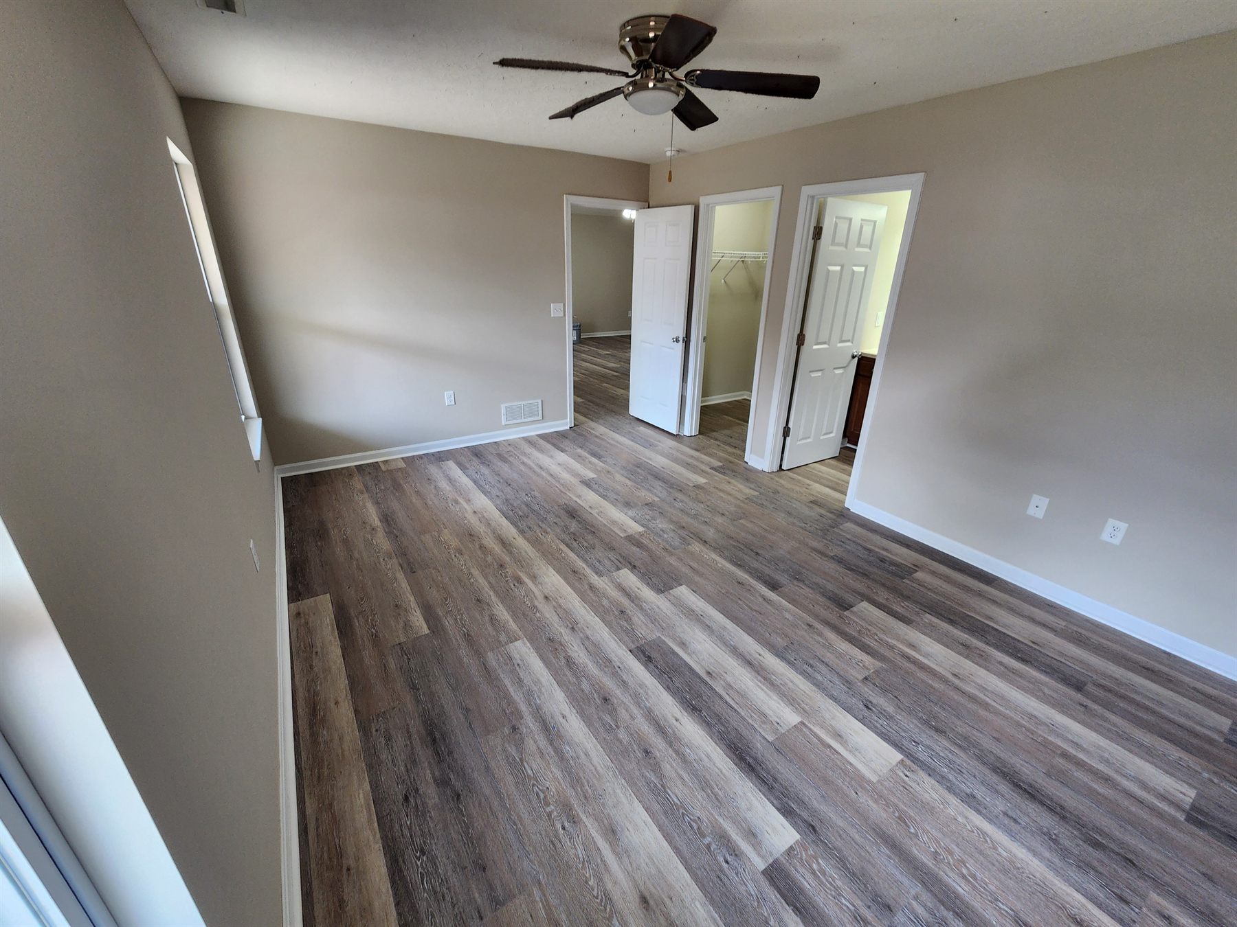 Finished bedroom and hallway with new LVP flooring